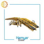 نوارنقاله بارگیری فله ۱۲ متری با طول ثابت و عرض سفارشی ۴۰ تا ۱۰۰ سانتی‌متر، مجهز به تسمه اجدار Chevron Belt برای حمل شن و ماسه و مصالح معدنی، تصویر از زاویه جانبی در محیط کارگاهی صنعتی.