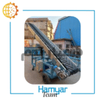 نوارنقاله بارگیری فله اجدار ۵ متری با عرض ۴۰–۱۰۰ سانت، شاسی سنگین، چرخ‌دار، موتور موتوژن، نمای سه‌ربع با پس‌زمینه کارگاه.